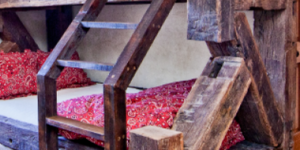 Reclaimed hand hewn beams made into a bunk bed and ladder from Superior Hardwoods of Montana
